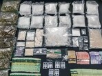 Drugs and cash recovered during an operation that led to the removal of two Indian nationals and the arrest of a third. (Credit: SPS)