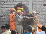 Firefighters and the SDRF team recovered the students' bodies after the fire broke out a three-floor commercial building in Lucknow, on Monday (Deepak Gupta/HT)