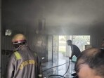 Firemen dousing flames at Eram College on Tuesday (HT Photo)