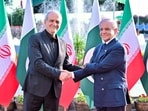 Pakistan's Prime Minister Shehbaz Sharif receives the President of Iran, Masoud Pezeshkian, upon his arrival at the Prime Minister's House in Islamabad, Pakistan.