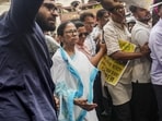 Kolkata: TMC chairperson Mamata Banerjee takes part in a protest march against hawker eviction without rehabilitation, in Kolkata, on June 17 (PTI) Kolkata: TMC chairperson Mamata Banerjee takes part in a protest march against hawker eviction without rehabilitation, in Kolkata, on June 17 (PTI)
