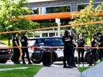 Montreal police work the scene of a shooting the day before, in Montreal on Tuesday, June 23.