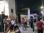Residents gather outside the clinic of homeopathic practitioners Tarsem Garg and Rajni Jindal, who are recently shifted allegiance from the AAP to the BJP, after the petrol bomb attack in Bathinda on Monday night. (Sanjeev Kumar/HT)