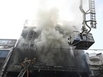 Smoke billows from a commercial building in Lucknow, on Monday (Deepak Gupta/HT)