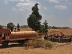 Thane, India - April 24, 2016: Around 80 villages in Shahpur Taluka are facing serious water crisis, who are been provided with the alternative water tankers at present. Villagers of Sidhha Wadi, gathers to fetch the water, after spotting the water tanker filling the well, at Shahpur in thane district. The water tankers have been provided to these villages after every alternate days which are 63 kms long from the Shahpur to Sidhha wadi village, India, on Sunday, April 24, 2016. (Photo by Praful Gangurde/Hindustan Times)