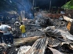 The blaze, which started around 11.20pm was extinguished by around 1pm after a total of 24 fire tenders were pressed into service, officials said. (Sanchit Khanna/HT Photo)