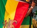 A man holds a Rastafari flag. (Representational) A man holds a Rastafari flag. (Representational)