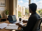 The man works remotely and lives with his parents in his hometown.