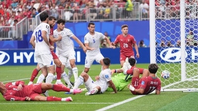 An unfortunate own-goal in the 60th minute piled on Uzbekistan's misery as they went 0-4 down. (AP Photo/Eric Gay) An unfortunate own-goal in the 60th minute piled on Uzbekistan's misery as they went 0-4 down. (AP Photo/Eric Gay)