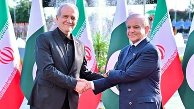 Pakistan's Prime Minister Shehbaz Sharif receives the President of Iran, Masoud Pezeshkian, upon his arrival at the Prime Minister's House in Islamabad, Pakistan. (REUTERS)
