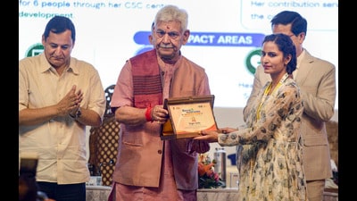 Jammu and Kashmir LG Manoj Sinha and agriculture ministerJavid Ahmad Dar (L) during the inauguration of ‘Seva se Samriddhi’ regional workshop on panchayat-led service delivery in Srinagar on Tuesday. (PTI) Jammu and Kashmir LG Manoj Sinha and agriculture ministerJavid Ahmad Dar (L) during the inauguration of ‘Seva se Samriddhi’ regional workshop on panchayat-led service delivery in Srinagar on Tuesday. (PTI)