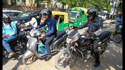 People seen riding motorcycles on the pedestrian pathway along the Sector 45/46 dividing road (Parveen Kumar/HT) People seen riding motorcycles on the pedestrian pathway along the Sector 45/46 dividing road (Parveen Kumar/HT)