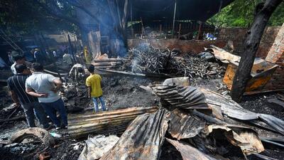 The blaze, which started around 11.20pm was extinguished by around 1pm after a total of 24 fire tenders were pressed into service, officials said. (Sanchit Khanna/HT Photo) The blaze, which started around 11.20pm was extinguished by around 1pm after a total of 24 fire tenders were pressed into service, officials said. (Sanchit Khanna/HT Photo)