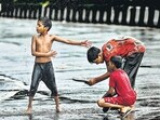 A group of children enjoy the long-awaited showers on Tuesday. The IMD has placed Mumbai under a yellow alert for Wednesday and Thursday, indicating chances of heavy rainfall. (Raju Shinde/HT Photo) A group of children enjoy the long-awaited showers on Tuesday. The IMD has placed Mumbai under a yellow alert for Wednesday and Thursday, indicating chances of heavy rainfall. (Raju Shinde/HT Photo)