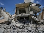 Hanan Qubaisi inspects her house destroyed in previous Israeli airstrikes in the town of Nabatiyeh, southern Lebanon, Wednesday, June 24, 2026, after a ceasefire between Israel and Hezbollah. 
