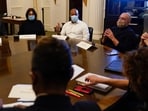 FILE - New York City Mayor Eric Adams, center, speaks during a cabinet meeting on his first day in office in New York, Jan. 1, 2022. To Adams' right is his Chief of Staff Frank Carone. (AP Photo/Seth Wenig, File)