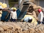 Foodgrain storage godowns in Punjab are currently choked to the brim with 150 lakh tonnes of rice remaining from the previous three seasons. Also, 54 lakh tonnes of paddy temporarily kept in mills is waiting to be shelled, which will add an additional 36 lakh tonnes of rice, worsening the severe storage crisis in the state. (HT File)
