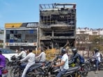 Lucknow officials issue a demolition notice for the three-storey commercial building over violations and illegal operations at the Aliganj area after a fire claimed 15 lives.