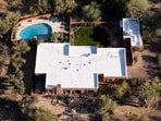 An aerial view of the home of Nancy Guthrie, the missing mother of "Today" show host Savannah Guthrie, in Tucson, Ariz., on Friday, March 6, 2026,. (AP Photo/Rebecca Noble,File)