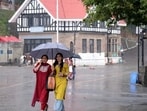 People walking with umbrellas amid rain in Shimla on Tuesday. (Deepak Sansta/HT) People walking with umbrellas amid rain in Shimla on Tuesday. (Deepak Sansta/HT)