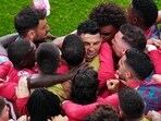 Portugal's Cristiano Ronaldo (centre) celebrates with teammates after scoring the opening goal against Uzbekistan in Group K of the World Cup in Houston on Tuesday. (AP)