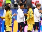 Ghana's Thomas Partey shakes hands with England players.