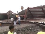 Massive chunks of iron beams and concrete crumbled during the construction, where several workers were engaged. Massive chunks of iron beams and concrete crumbled during the construction, where several workers were engaged.