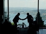 Delegation staff members meet in the lobby on the day of a quadrilateral meeting between the United States, Iran, Pakistan and Qatar at the Burgenstock luxury hotel complex overlooking Lake Lucerne, Switzerland, on June 21, 2026