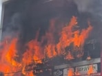 The massive fire at the three-floor commercial building housing an animation centre in Aliganj area in Lucknow. (HT Photo)