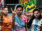 Women wearing masks of Lionel Messi pose for a photograph as they celebrate his birthday in Kolkata on Wednesday. (AFP)