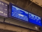 An information board advises not to enter trains due to a "nationwide train radio outage" at the main train station in Munich, Germany, June 23