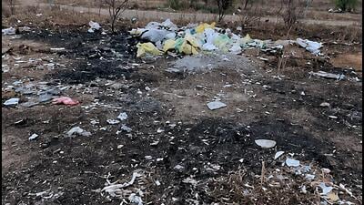 People allege waste has been dumped and burnt for months, filling neighbourhoods with smoke and foul odour. Civic officials say they will inspect the site. (HT) People allege waste has been dumped and burnt for months, filling neighbourhoods with smoke and foul odour. Civic officials say they will inspect the site. (HT)