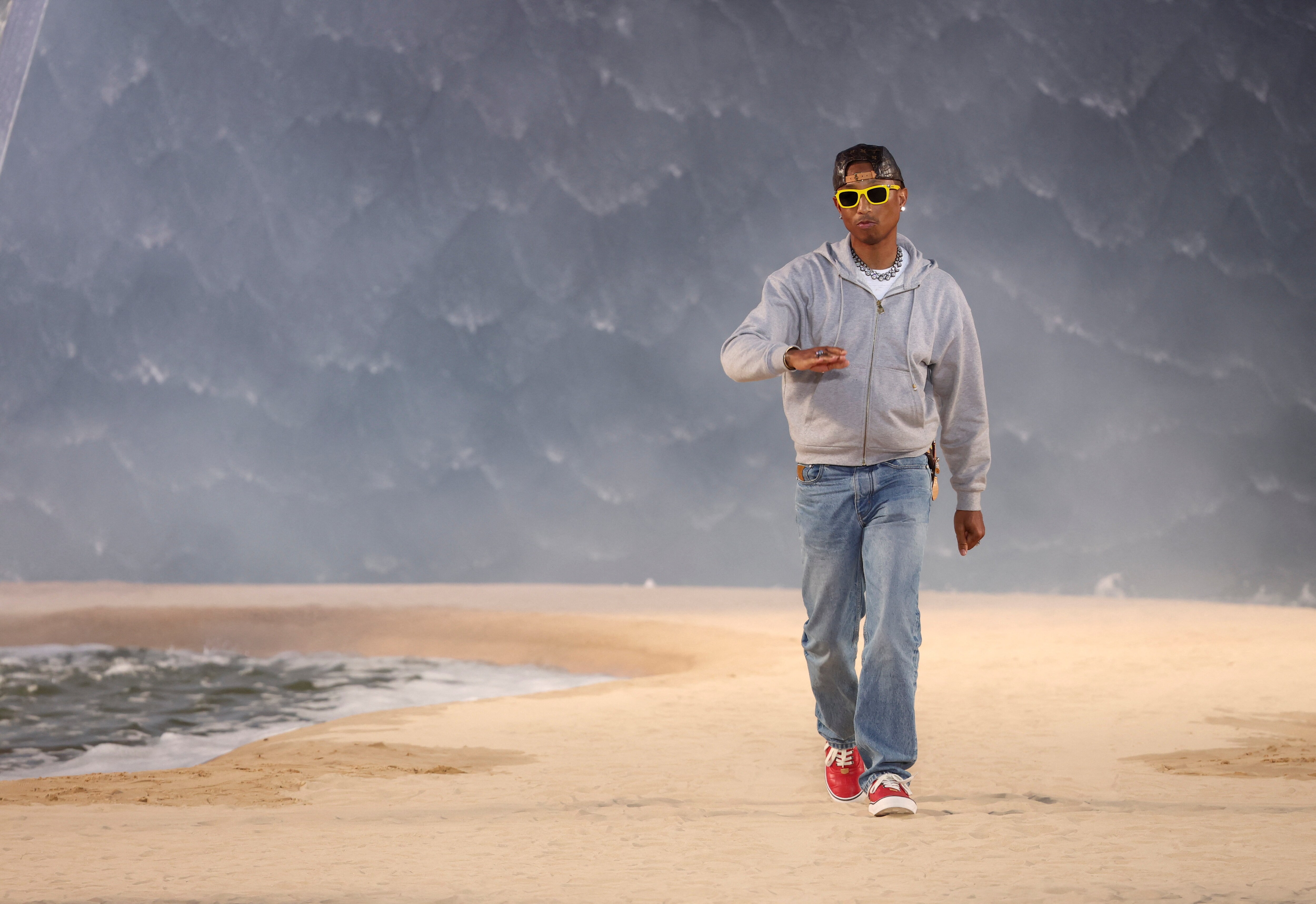 Designer and musician Pharrell Williams appears at the end of his Menswear Spring-Summer 2027 collection show for fashion house Louis Vuitton during Men's Fashion Week in Paris, France, June 23, 2026. REUTERS/Gonzalo Fuentes (REUTERS)