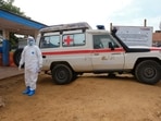 A doctor wearing personal protective equipment (PPE) stands near an ambulance at the Ebola Virus Disease Treatment Center at the Bunia General Reference Hospital. (Photo for representation)