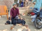The Rottweiler in the process of being rescued by the police and the animal welfare department (HT Photo)