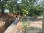 The ongoing pipeline laying process at the Leisure Valley in Ludhiana on Thursday. (HT Photo)
