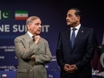 Pakistan's Prime Minister Muhammad Shehbaz Sharif, left, stands with Pakistan's Chief of Army Staff Field Marshal Asim Munir