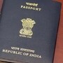 An Indian passport placed on top of a Colombian passport on a highly polished rosewood table. The passports are reflected on the polished wooden surface. The Indian passport has two booklets attached to each other denoting a much travelled holder. The holder obviously needed additional pages. The countries' details and emblems are in gold print on the documents' covers. Horizontal format. Copy space. (Getty Images/iStockphoto)(HT_PRINT)