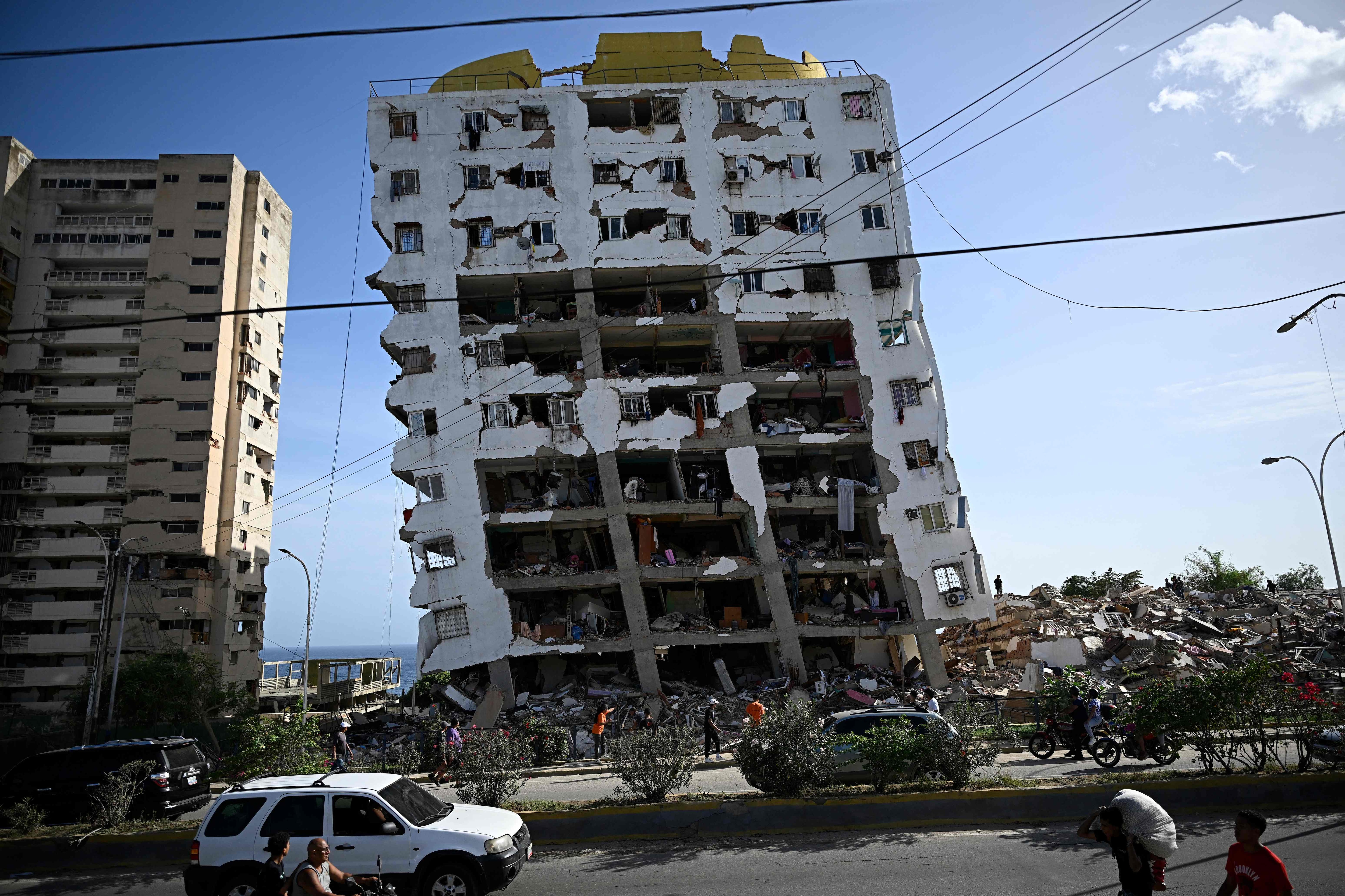A view shows a heavily damaged apartment building following an earthquake in Catia La Mar, La Guaira state, about 30 km northwest of Caracas. (AFP) A view shows a heavily damaged apartment building following an earthquake in Catia La Mar, La Guaira state, about 30 km northwest of Caracas. (AFP)