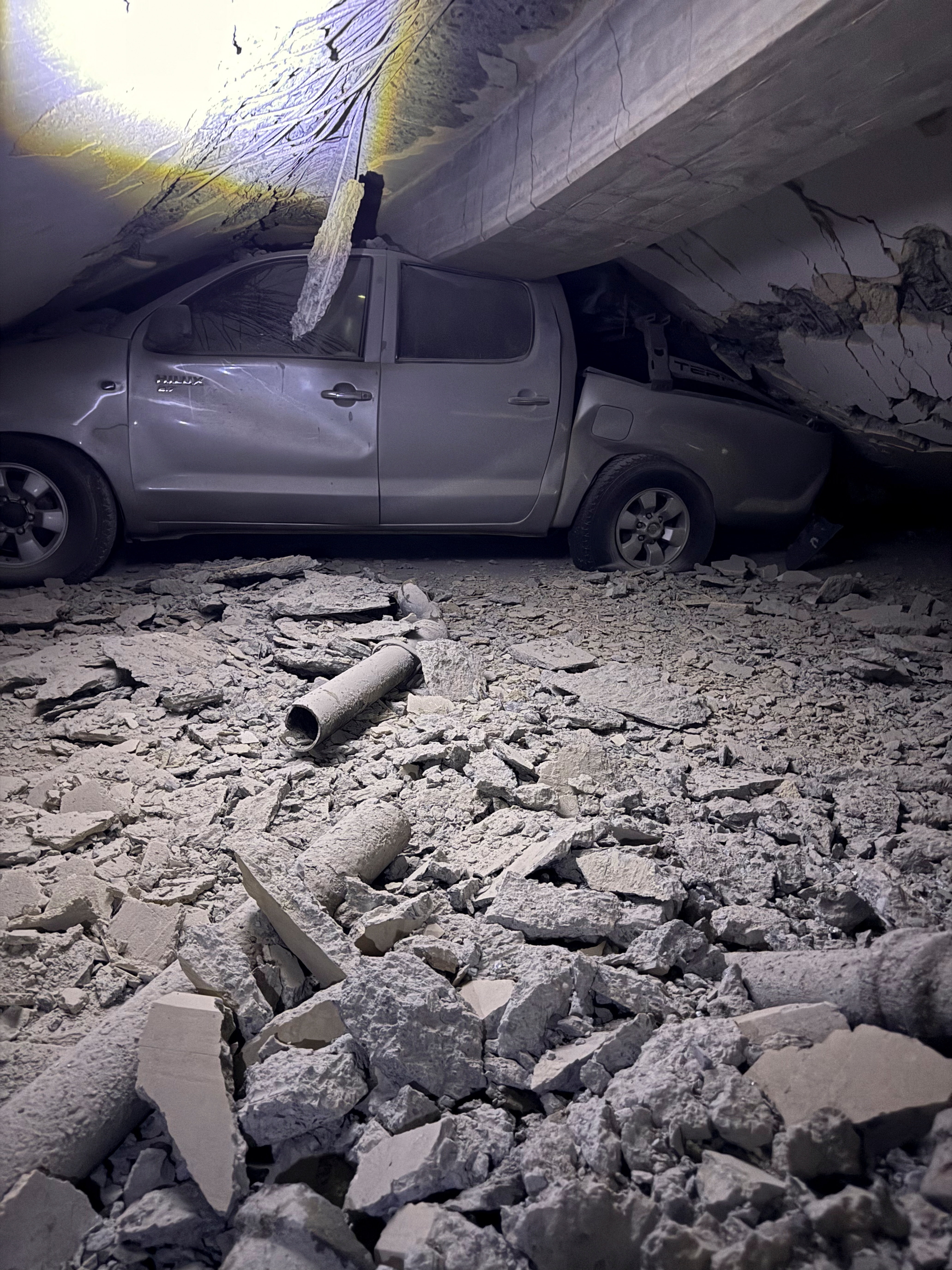 A car under the rubble of a building in the aftermath of earthquakes, in Caraballeda, La Guaira state, Venezuela, June 24, 2026.  Jose Alberto Gallipoli Lameda/via REUTERS  THIS IMAGE HAS BEEN SUPPLIED BY A THIRD PARTY. MANDATORY CREDIT. NO RESALES. NO ARCHIVES.  Verification Lines:  Reuters confirmed the location from road layout, buildings and signage which matched archive and satellite images. Location and date of the video are also verified by original file metadata. (via REUTERS)