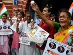 Members of the Indian National Trade Union Congress (INTUC) hold eggs during a protest at the Kolkata Municipal Corporation head office.