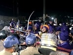 Police and Nihang Singhs face off at the Himachal–Uttarakhand border as authorities halt the group's march towards Dehradun, in Dehradun on Thursday. 