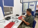 At DFS’s control room, a telecaller notes details of a fire in a handwritten form and sends it to a broadcast desk who then calls and informs the nearest fire station. (HT)