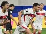 Turkey defender Kaan Ayhan celebrates after scoring his team's winning goal. 