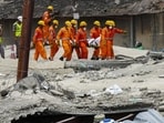 NDRF and Army personnel carry the mortal remains of a victim during a rescue operation after an under-construction warehouse collapsed on Wednesday. (PTI) NDRF and Army personnel carry the mortal remains of a victim during a rescue operation after an under-construction warehouse collapsed on Wednesday. (PTI)