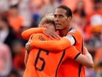 The Dutch celebrate after sealing a place in the Round of 32.