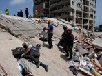 Residents and rescue workers search for survivors in Catia aa Mar, Venezuela, Friday, June 26, 2026, two days after twin earthquakes struck the country. Residents and rescue workers search for survivors in Catia aa Mar, Venezuela, Friday, June 26, 2026, two days after twin earthquakes struck the country.