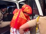 Police personnel escort accused Siya to the Lonavala Gramin Police Station for questioning in connection with the Ketan Agarwal death case