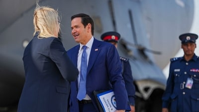 US Secretary of State Marco Rubio speaks with the US ambassador to Bahrain Stephanie Hallett before boarding a US Air Force C-17 Globemaster III transport aircraft after his visit to the Middle East to discuss the interim deal between the US and Iran with Arab Gulf allies, in Manama on June 25, 2026. (AFP) US Secretary of State Marco Rubio speaks with the US ambassador to Bahrain Stephanie Hallett before boarding a US Air Force C-17 Globemaster III transport aircraft after his visit to the Middle East to discuss the interim deal between the US and Iran with Arab Gulf allies, in Manama on June 25, 2026. (AFP)
