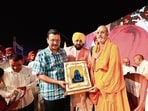AAP national convener Arvind Kejriwal and Punjab chief minister Bhagwant Mann attending ‘Ek Sham Bhagwan Shivji Ke Naam’ event in Amritsar on Saturday. (HT Photo)